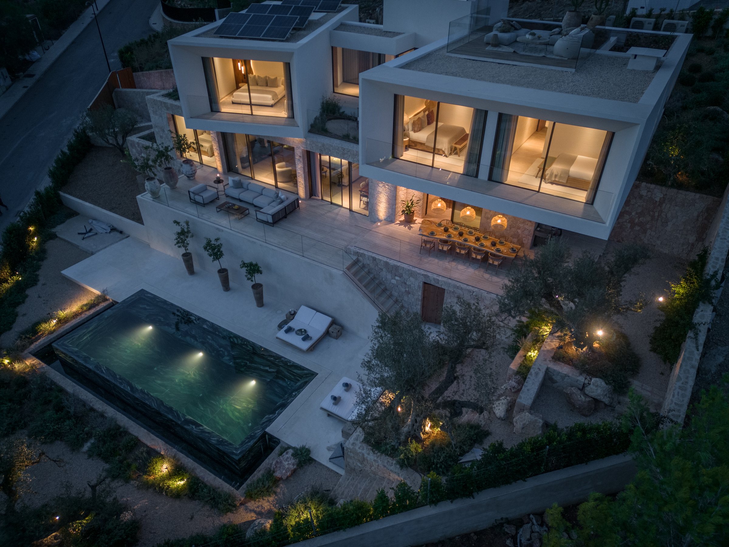 Contemporary residence and pool viewed at dusk