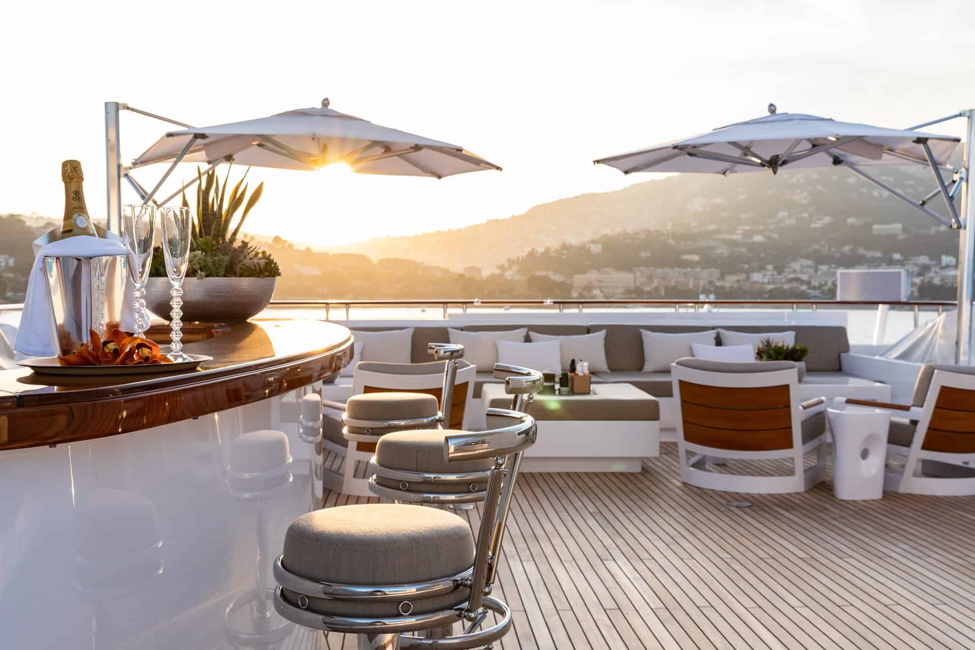 Open superyacht deck at sunset